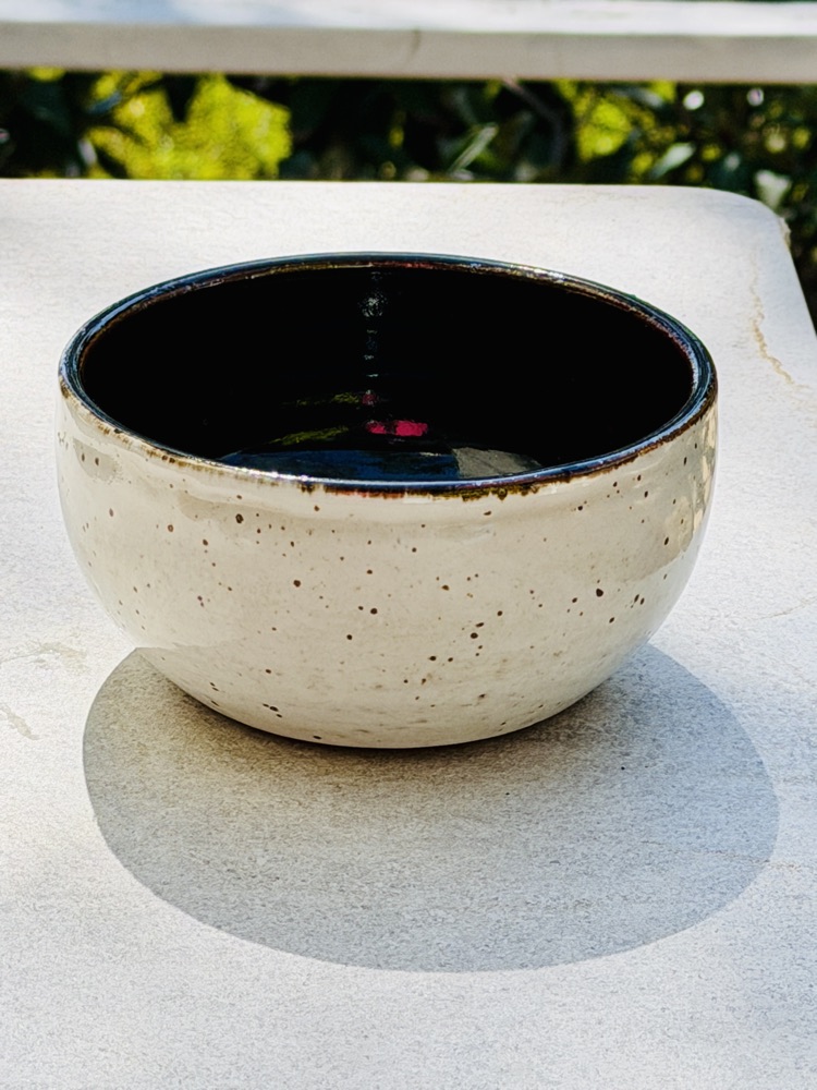 Black and white bowl (bottom glaze defect), handmade by Suzanne Luna