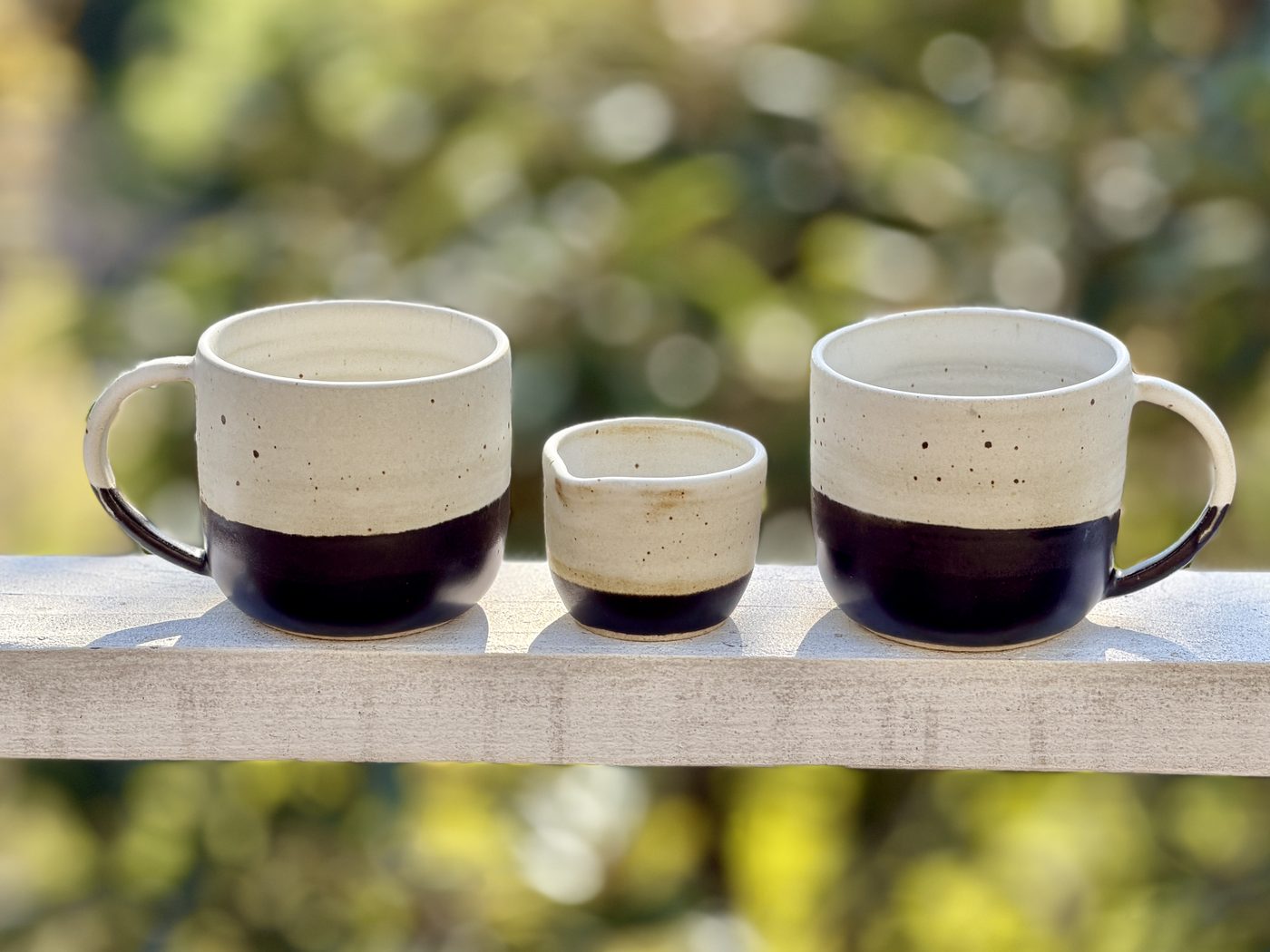 Stoneware “Day to Nite” mugs with creamer, handmade by Suzanne Luna