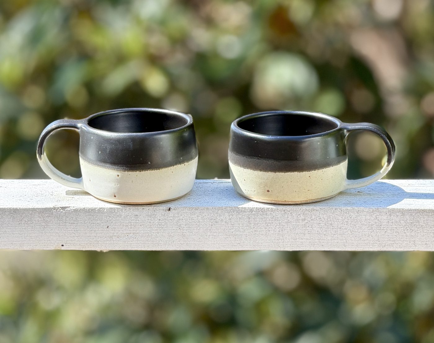 Stoneware pair of “Nite to Day” mugs, handmade by Suzanne Luna