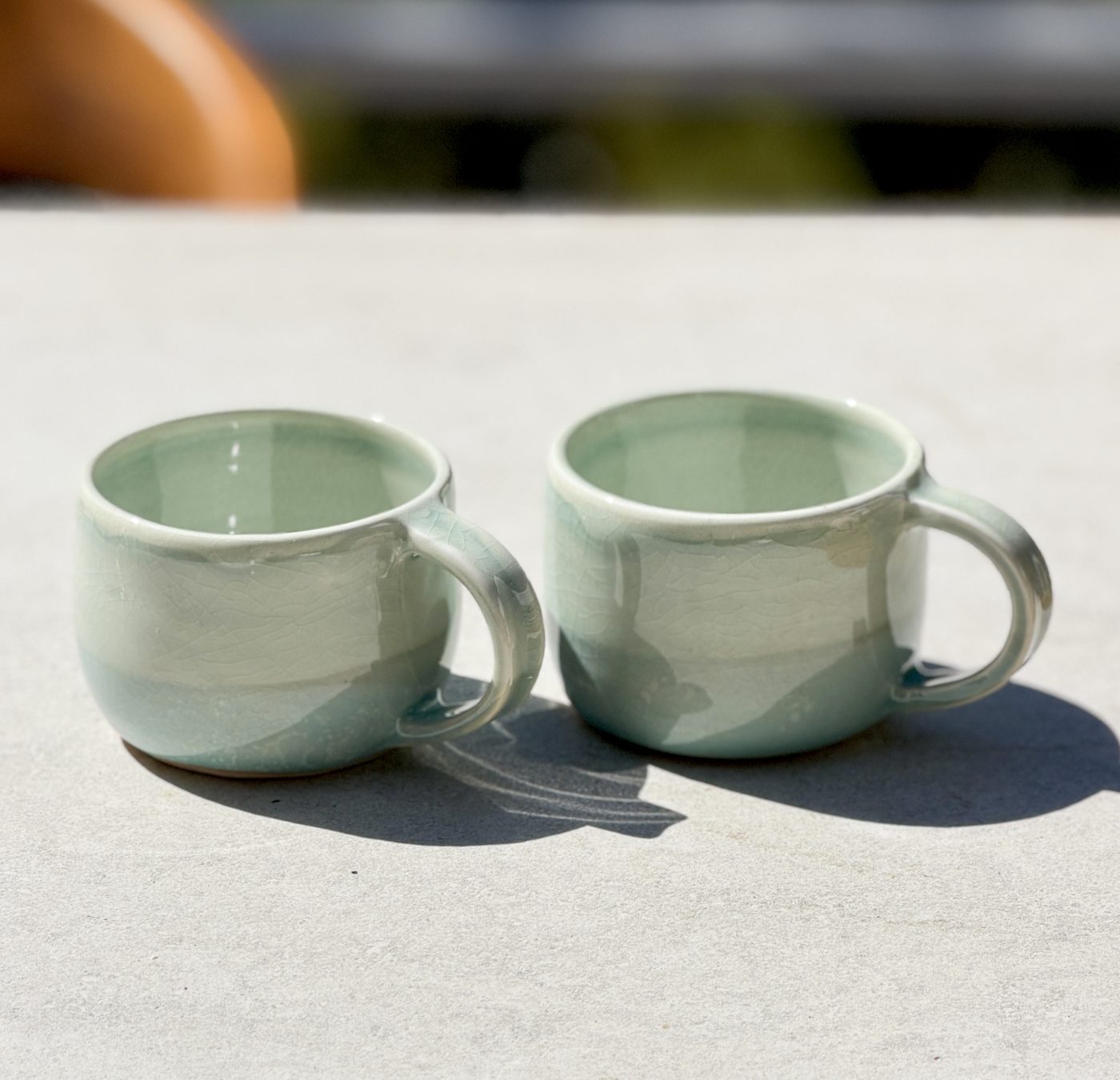 Porcelain pair of “Sand to Sea” mugs, handmade by Suzanne Luna