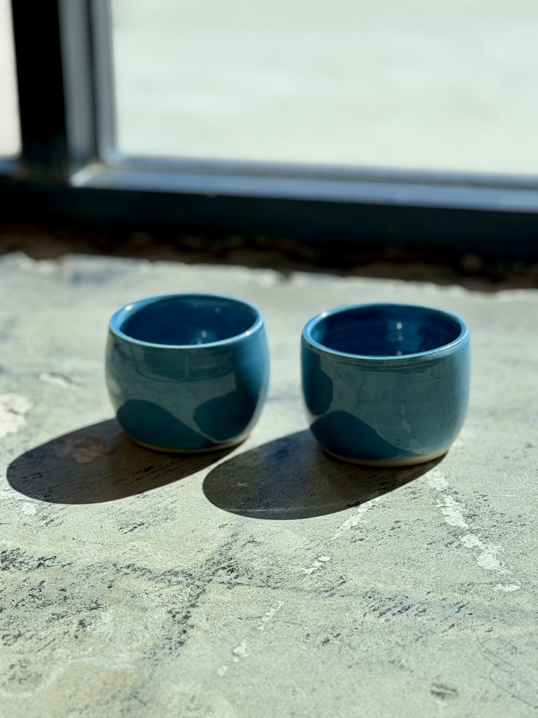 Porcelain handle free Peacock Blue mugs with white hearts., handmade by Suzanne Luna