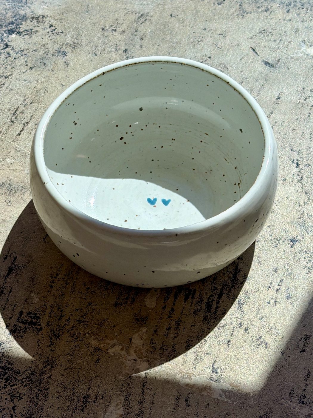 Stoneware medium white speckled bowl two hearts, handmade by Suzanne Luna