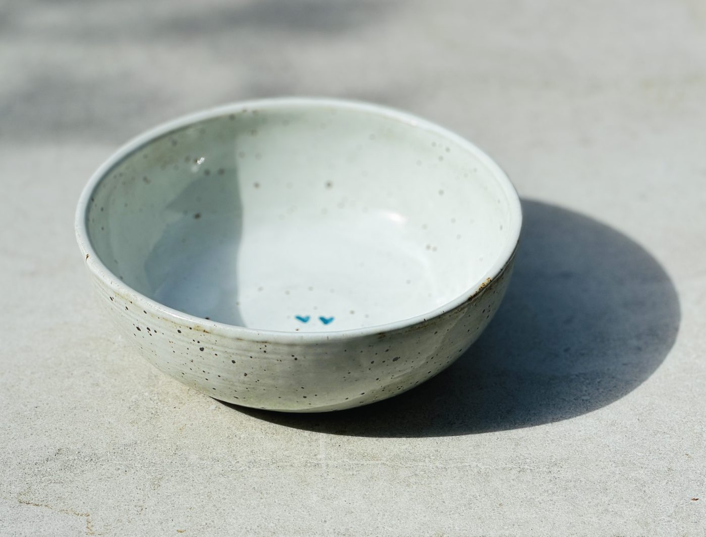 Stoneware Large speckled white bowl with two hearts, handmade by Suzanne Luna