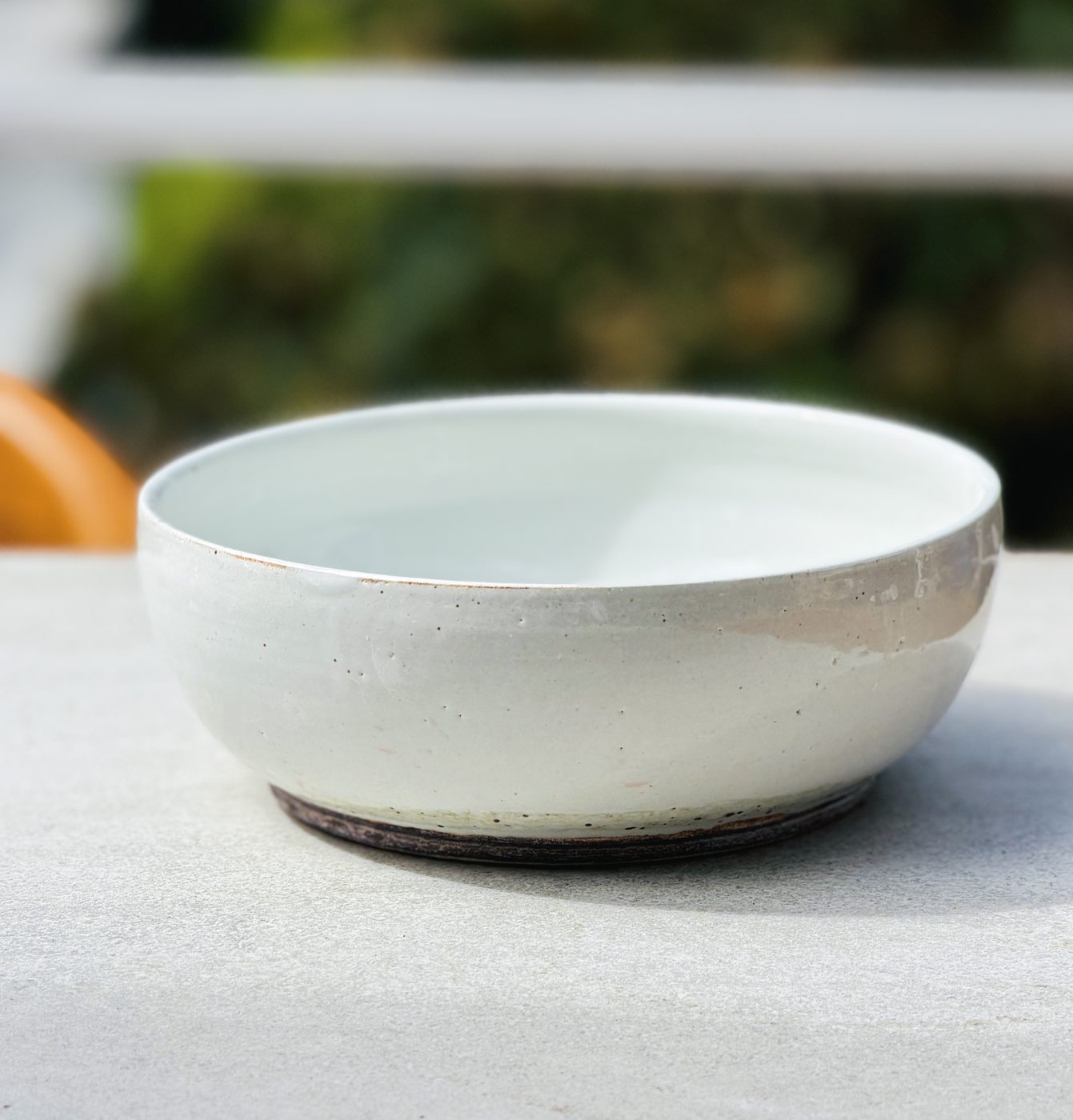 Stoneware large white bowl with dark clay bottom foot, handmade by Suzanne Luna