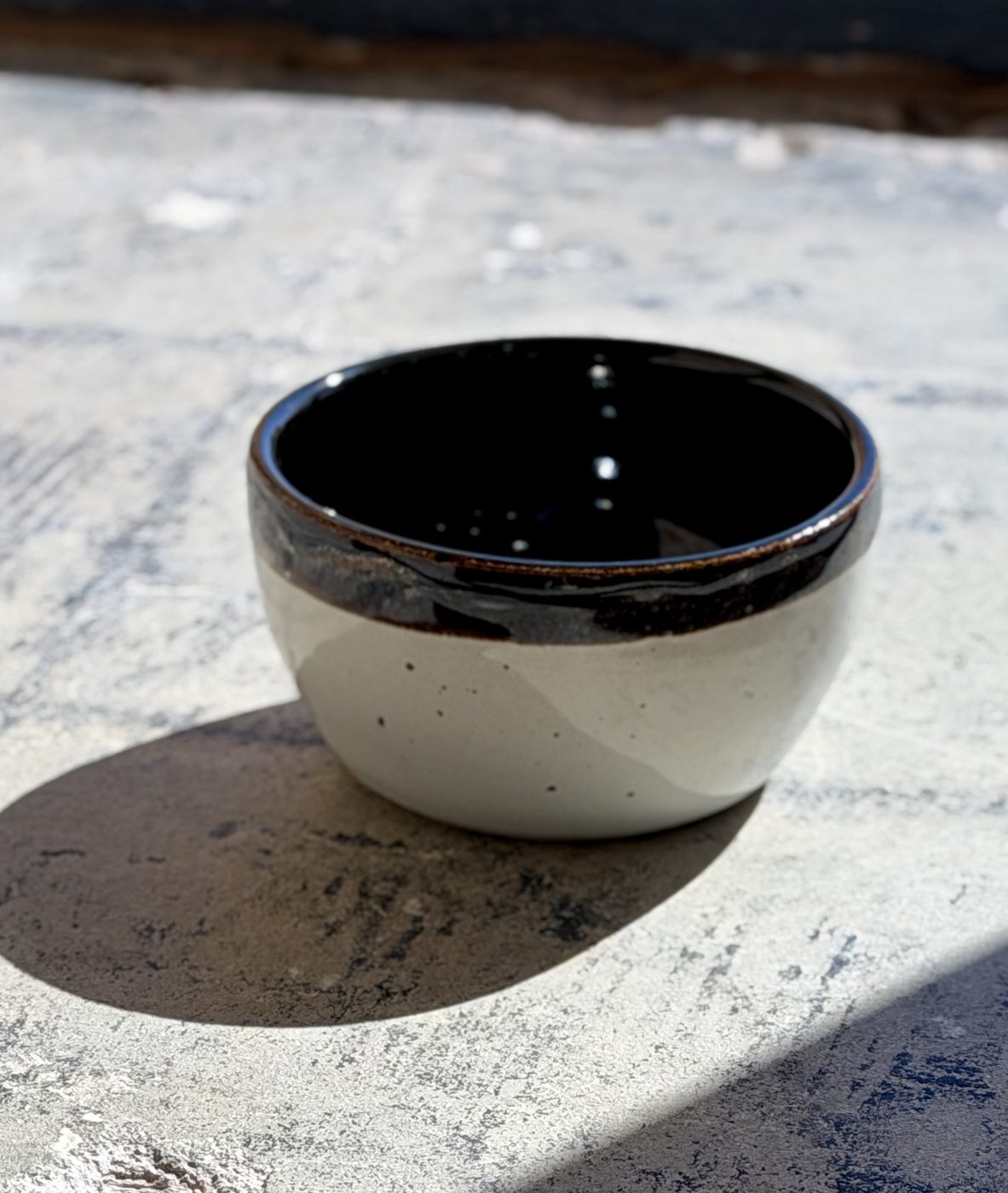 Stoneware Black and White bowl with black int./rim and White ext., handmade by Suzanne Luna