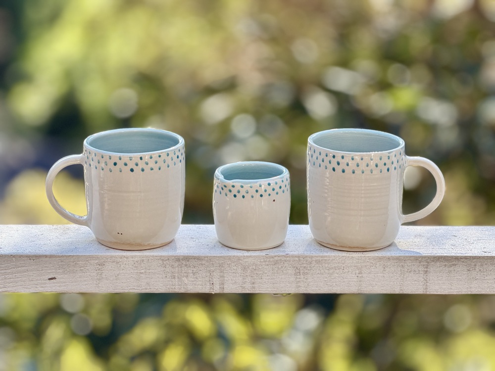 Porcelain White and blue with blue dots and creamer  (discounted for glaze bubbles in one mug), handmade by Suzanne Luna