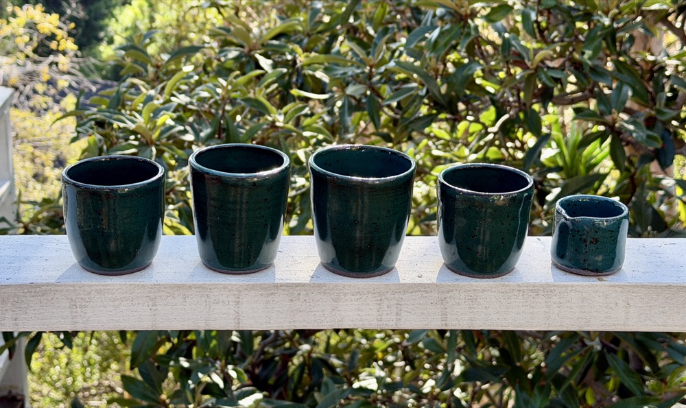 Teal 4 cups and creamer, handmade by Suzanne Luna